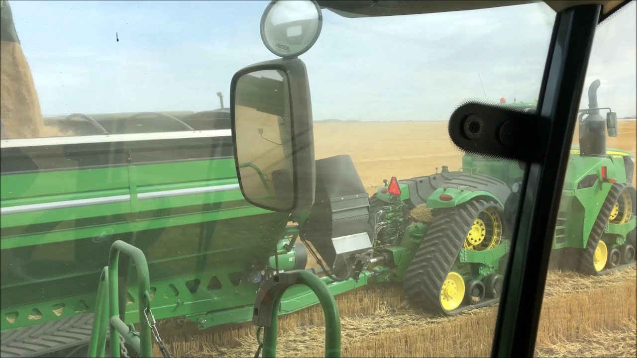 John Deere S790's combining oats in Saskatchewan