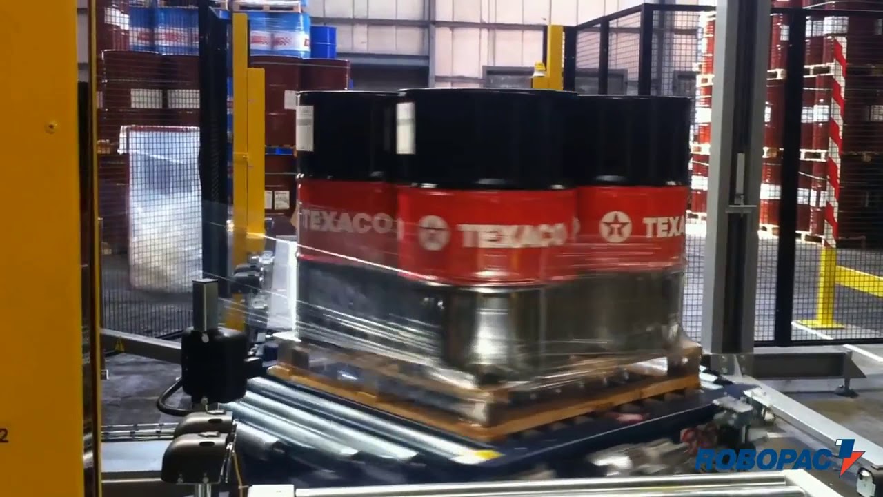 ROTOPLAT 3000 automatic stretch wrapper wrapping oil barrels video by Robopac USA