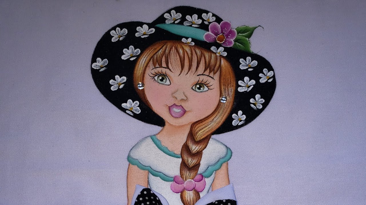 Boneca pintada em pano de prato