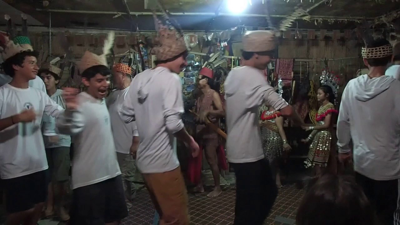 Ross School boys in Borneo, dancing in traditional Iban style.