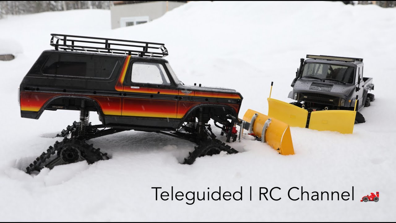 Traxxas Bronco with Traxx vs Axial UMG 10 6x6 in Snow Plowing Challenge | Teleguided RC
