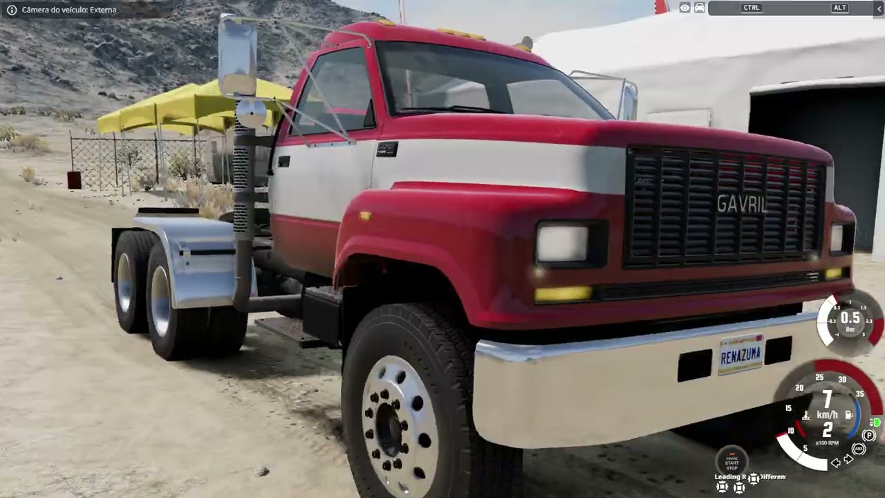 Caminhão vermelho e prata Gavril Durham CT85 Tandem Semi Truck na área de trailers de Johnson Valley