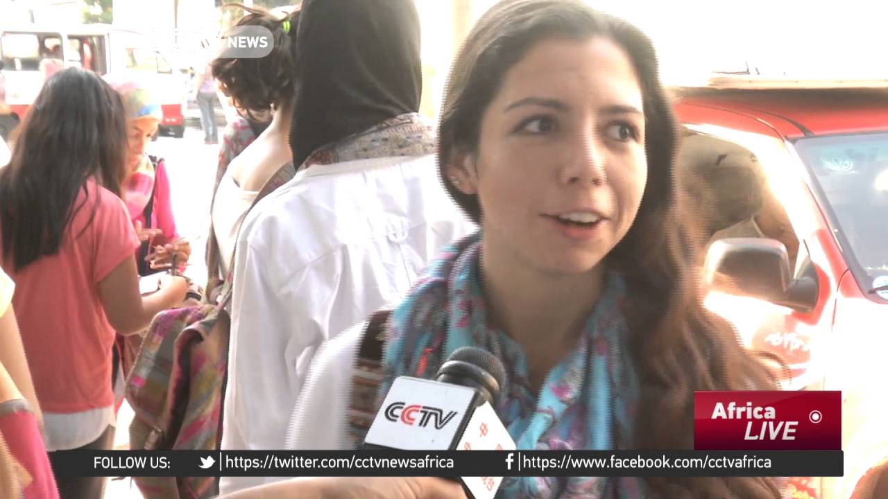Women on bicycles travel around Cairo to hand out food parcels