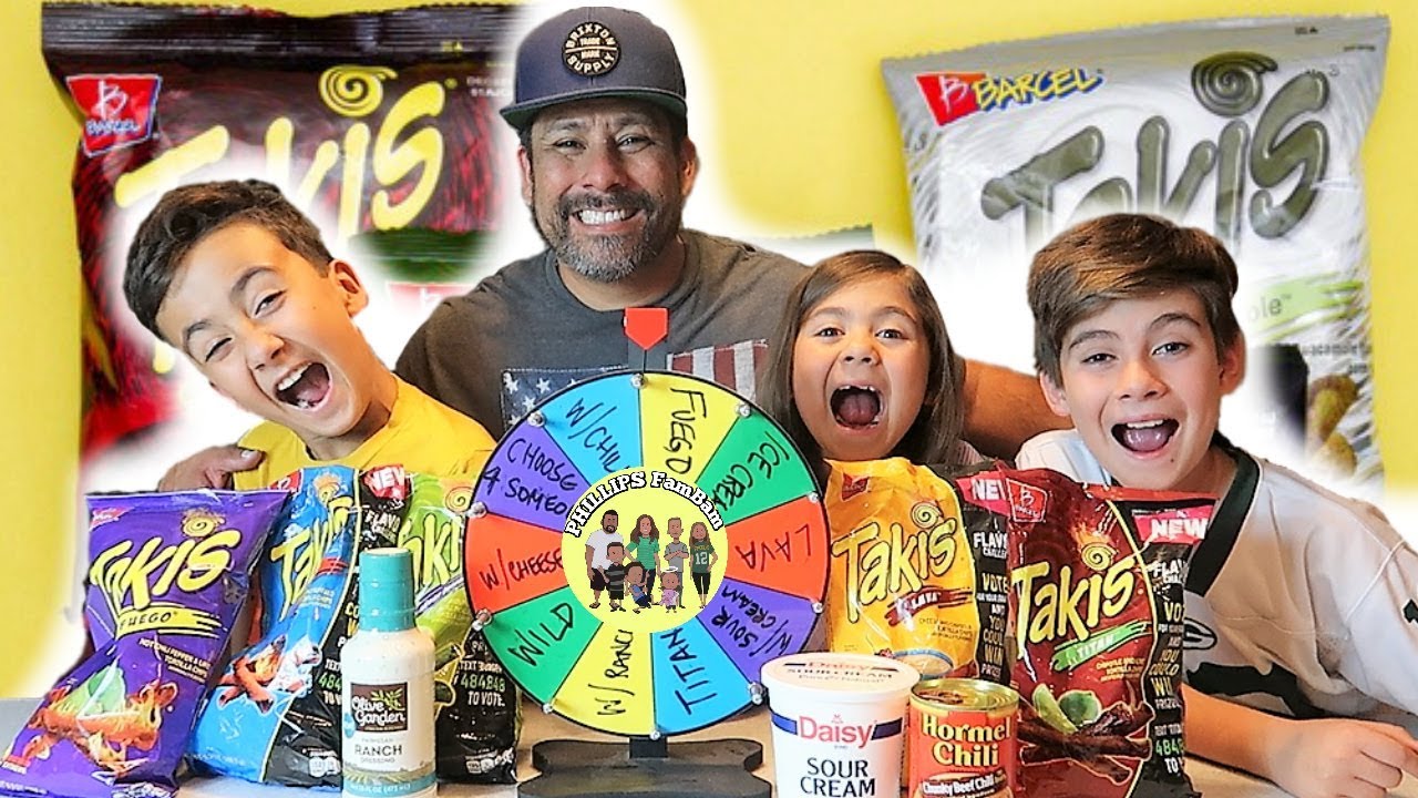 MYSTERY WHEEL OF HOT SPICY TAKIS CHALLENGE | TAKIS SNACK FOOD TASTE TEST | PHILLIPS FamBam
