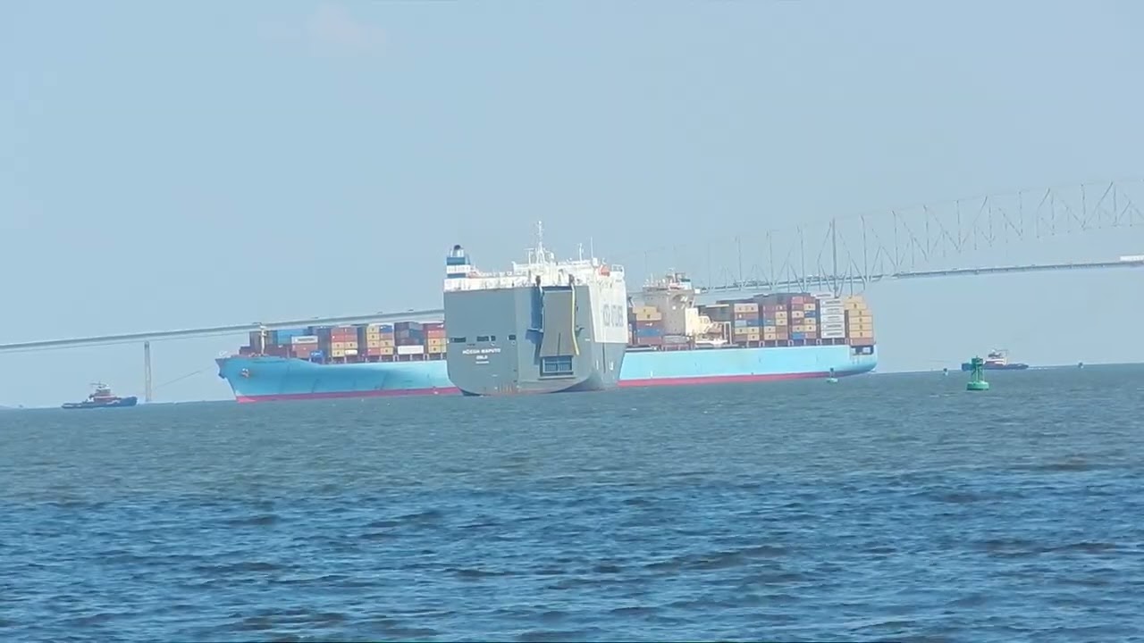 Tugs Tethered to Ship Passing Under Key Bridge