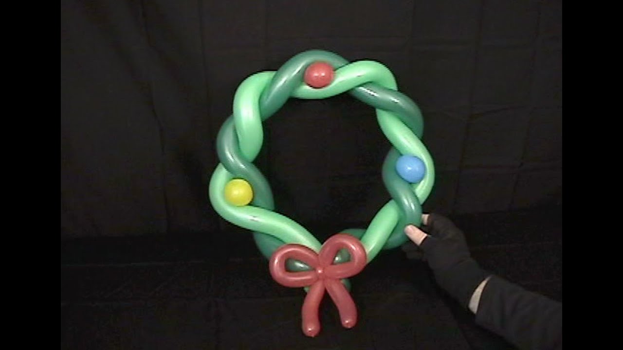 Learn how to make a balloon animal wreath using balloon twisting