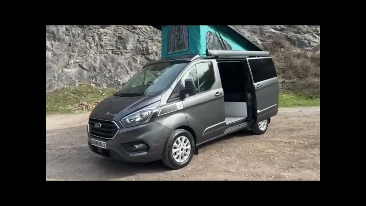 Grey Ford Transit Dormobile camper with Pop Top roof