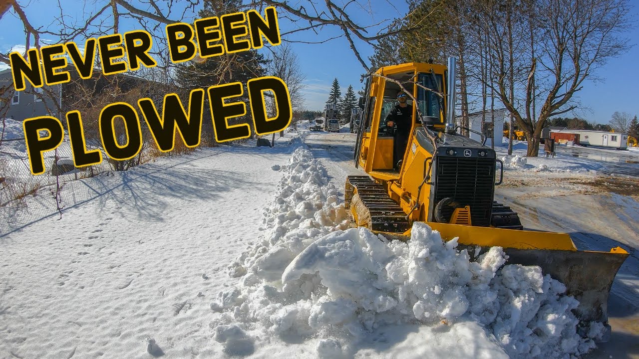 Plowing Untouched Snow with Bulldozer....neglected snow at yard