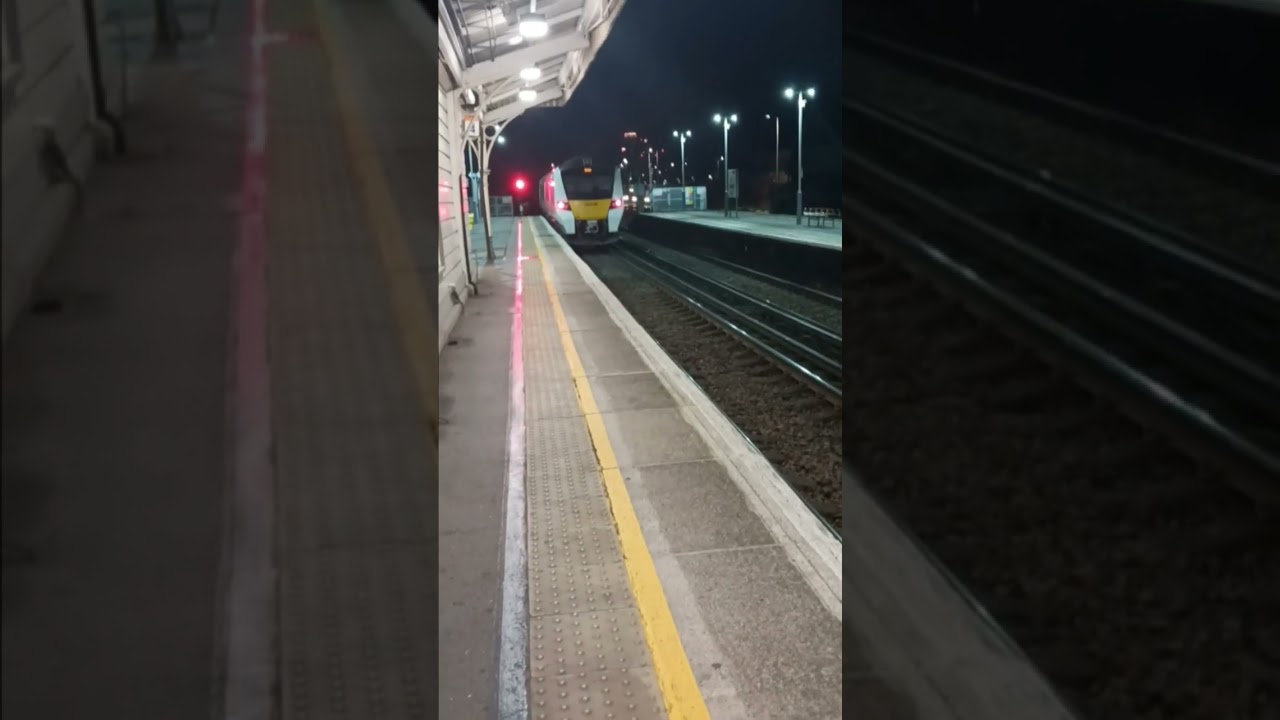 class 700 passes at speed with a 2 tone
