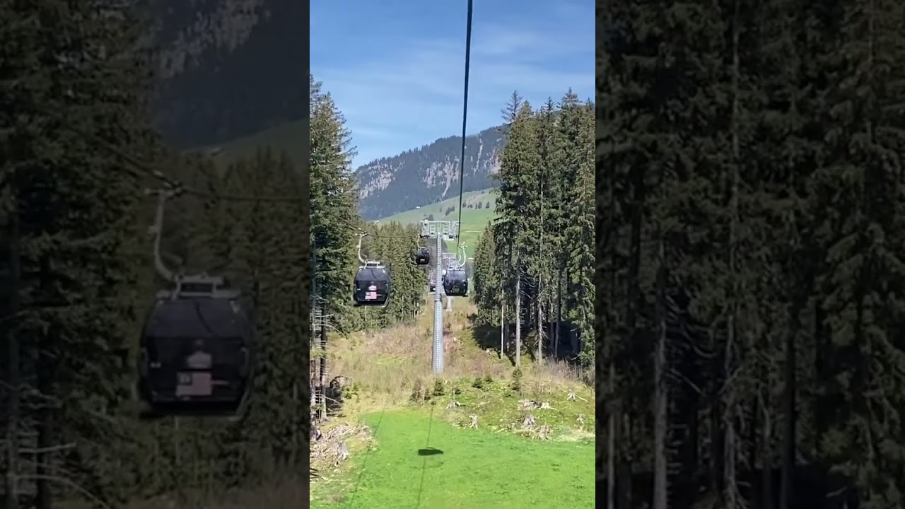 Titlis cable cars from Engelberg to Trubsee in Swiss Alps, display flags of countries!