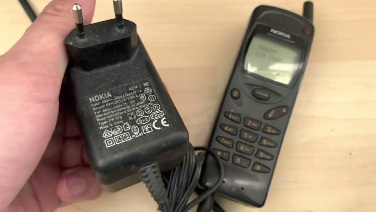 Nokia 3110 type NHE-8 retro style mobile cellphone from pre-smartphone period with charger test