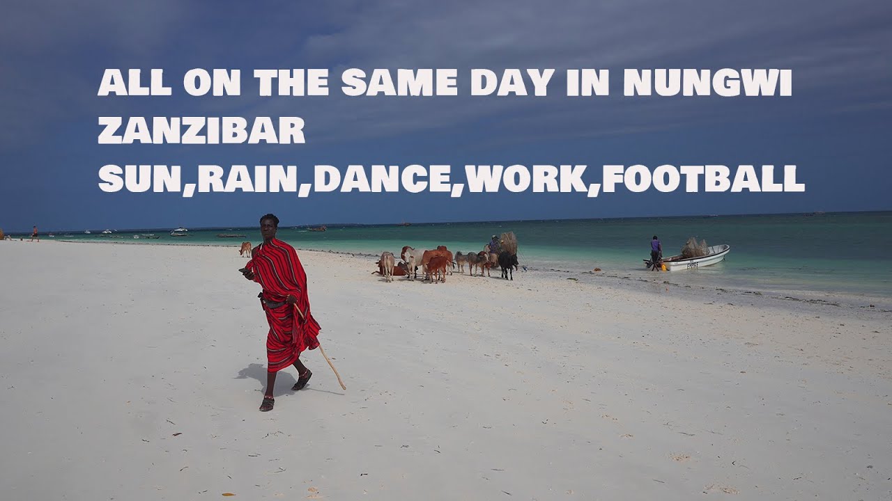 all on the same day in Nungwi Zanzibar,sun,sea, rain,dance,football,cows walking on the beach