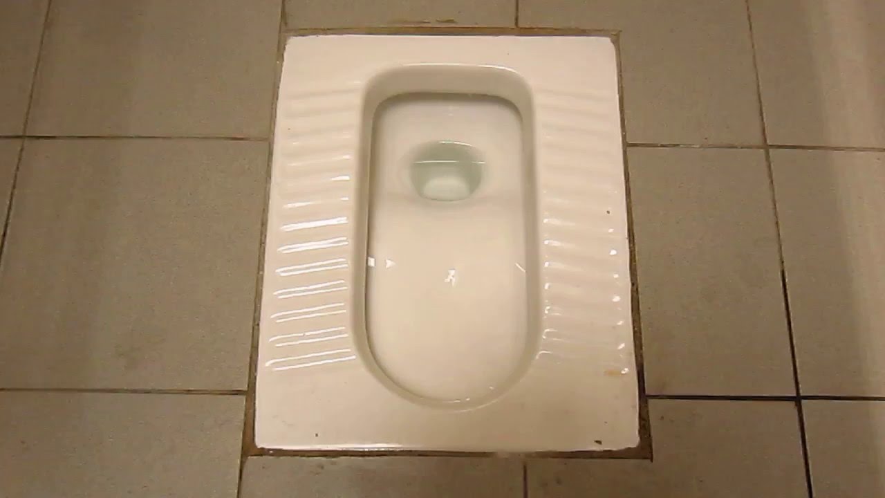 Squat toilet flush @ Amoy Street Public Toilet