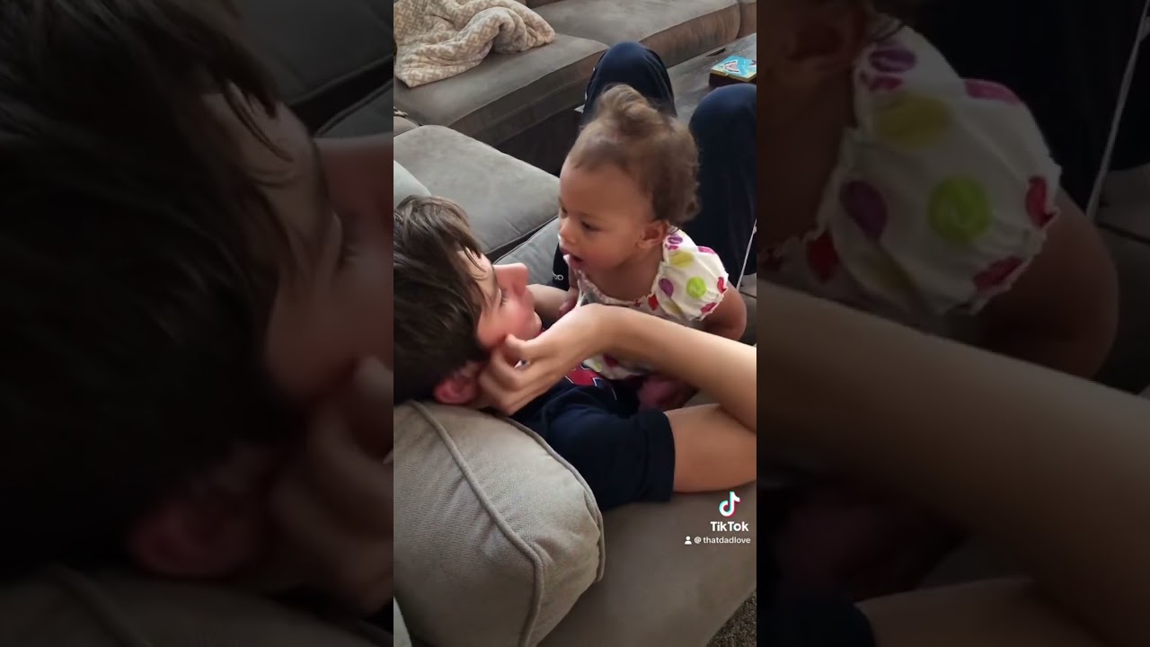 Baby sister is super cute as she tries to give big brother a kiss. ❤️#siblings
