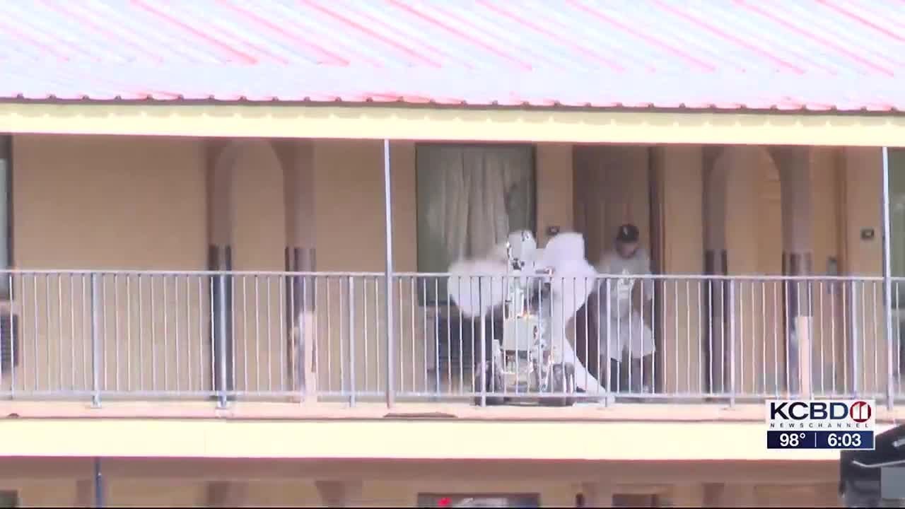 Wanted man barricaded in Lubbock motel room shot, gassed out and taken into custody
