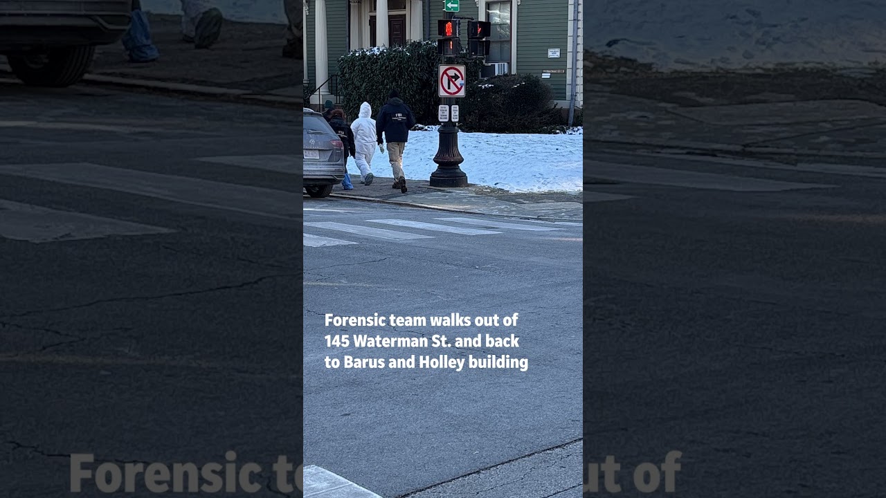 FBI evidence team sweeps snow for evidence on Dec. 15, 2025 at Brown University