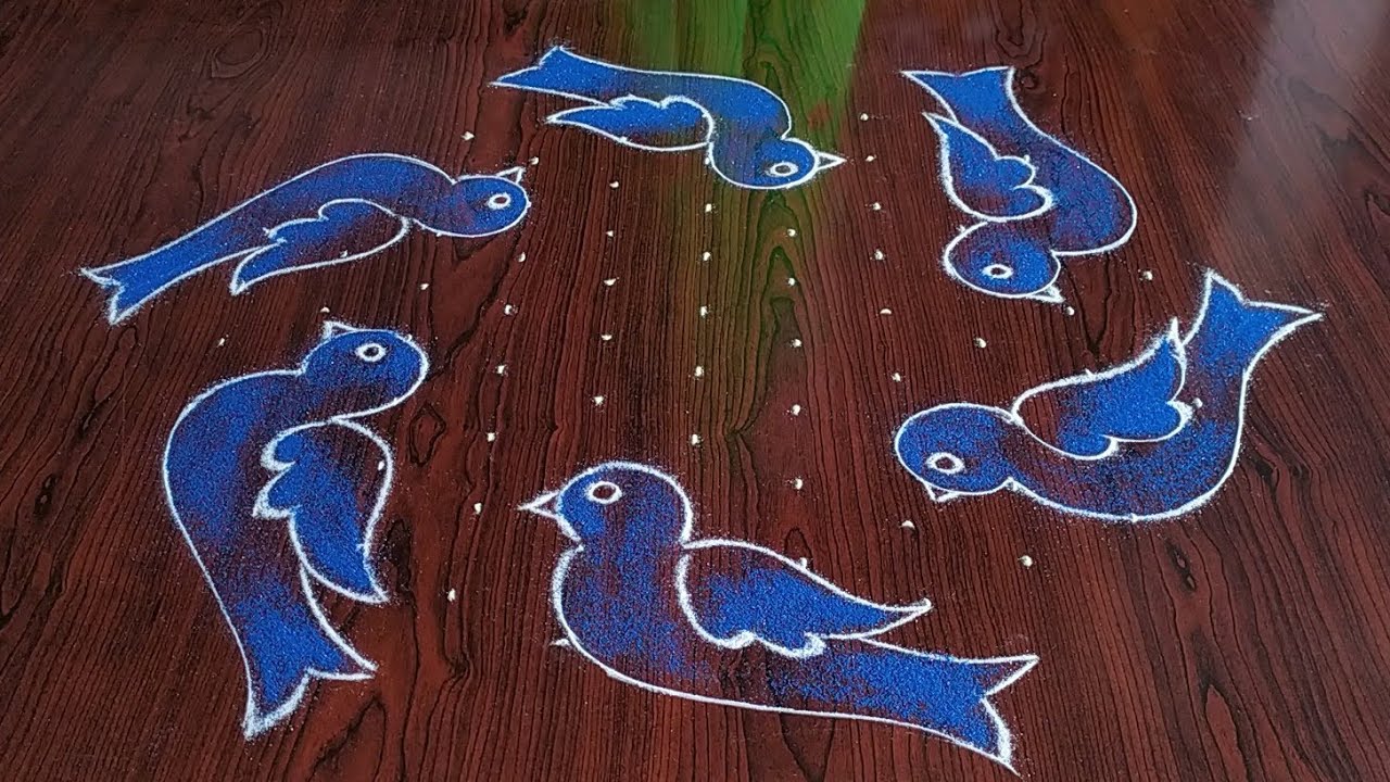 Sankranthi chukkalu muggulu (11×6) dot's.. beautiful Bird's rangoli