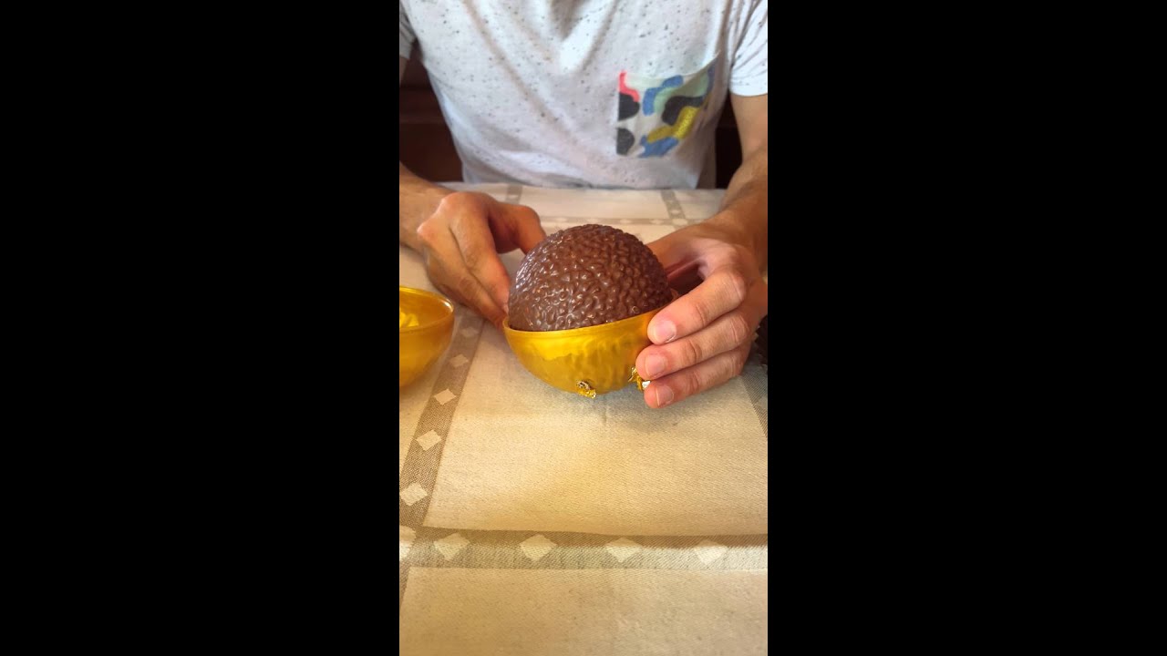 Unwrapping a Grand Ferrero Rocher
