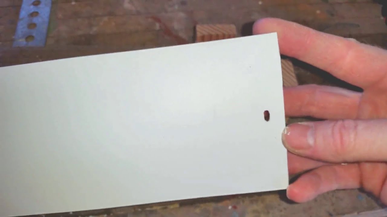 Cutting vertical blinds and jig for cutting hanging slots.