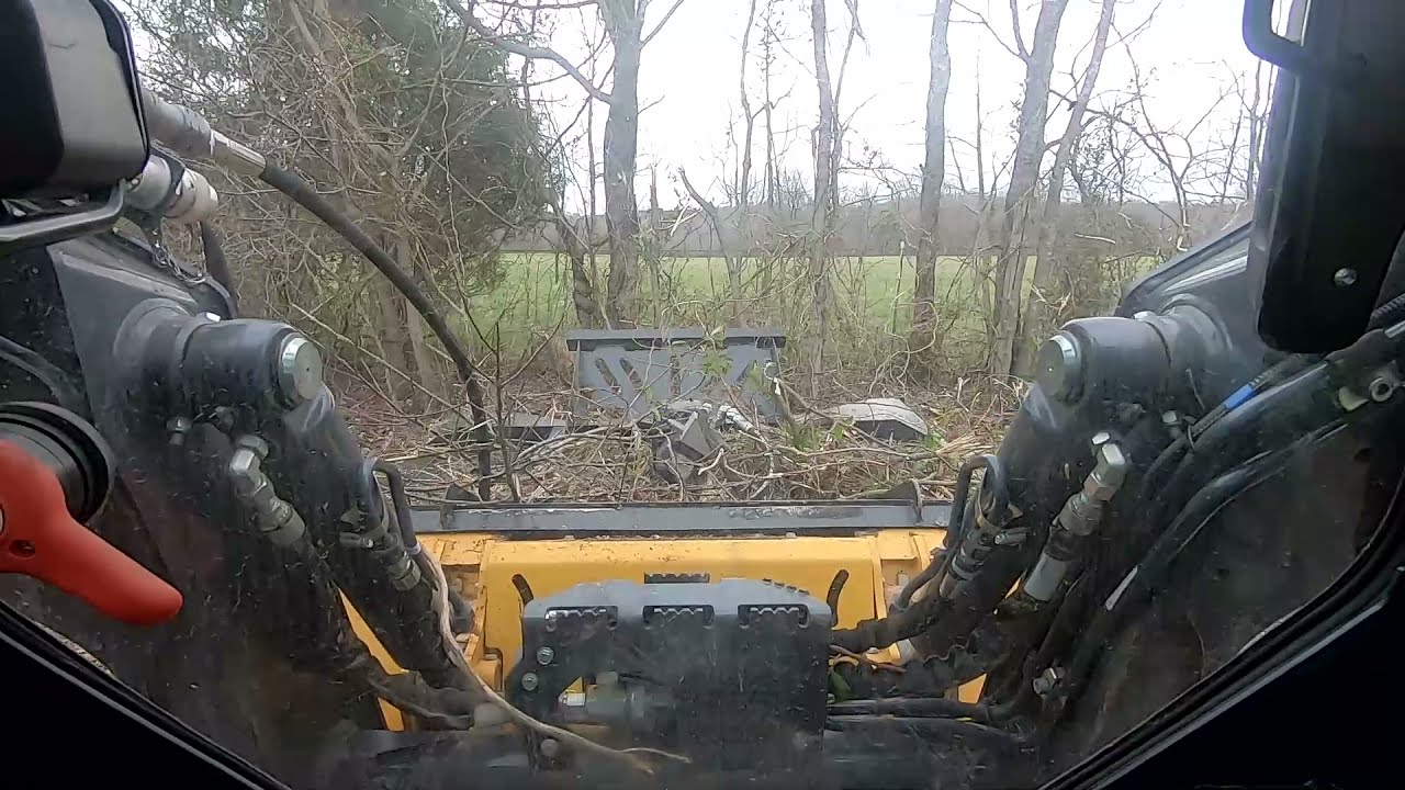 John Deere 317G Compact Track Loader Piling Brush & Trimming Tree Limbs. Cutting field limbs part 2