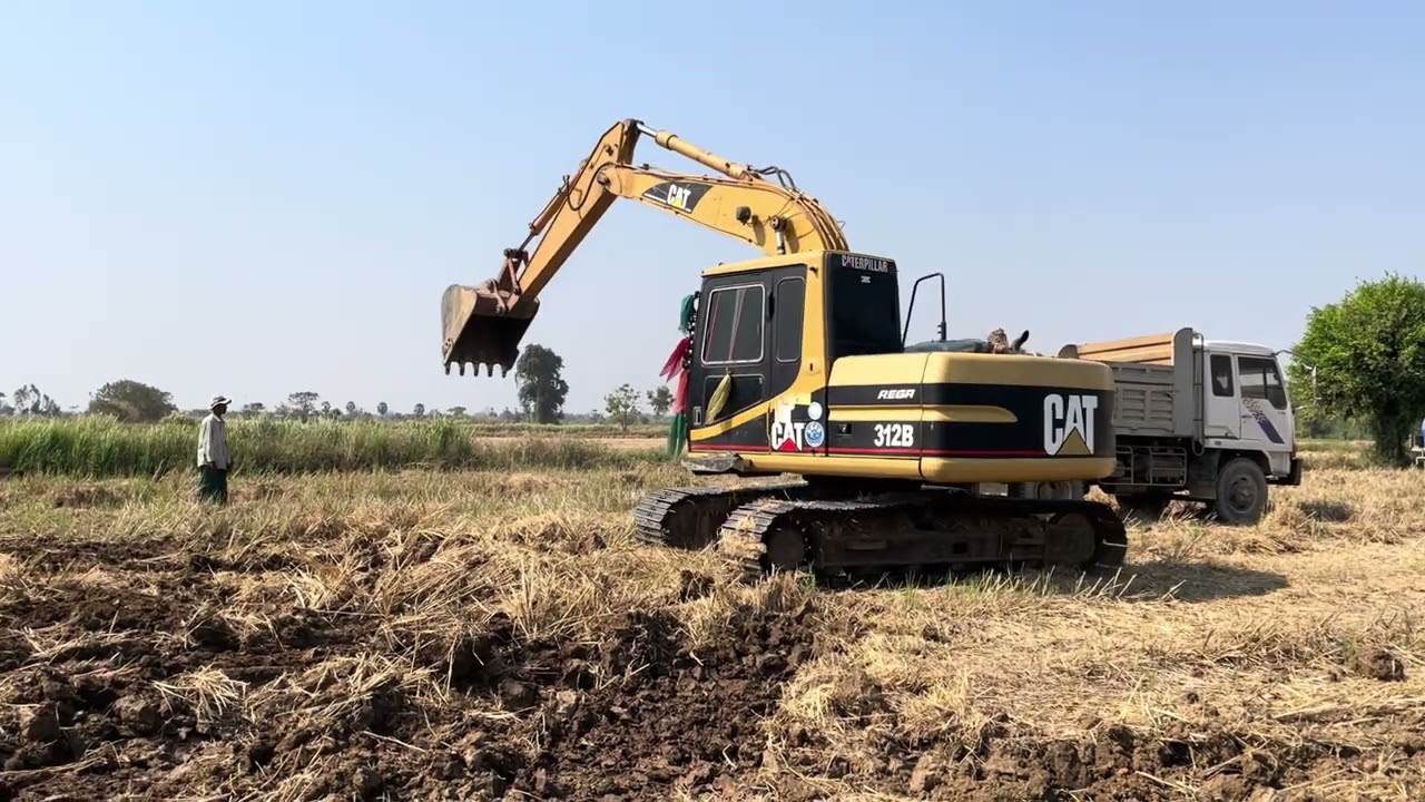 Excavator Loading Soil On 2 Axle Mercedes & MAN Trucks