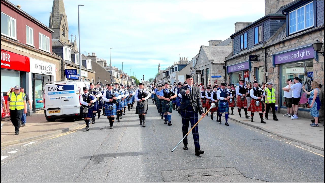 Drum Major leads the Pipes & Drums march through Inverurie after 2025 Garioch Championship Scotland