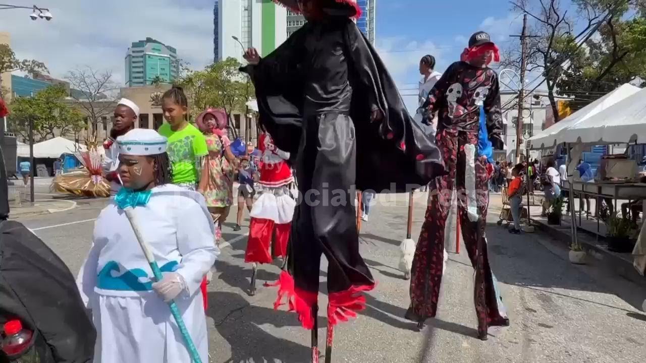 Children learn to dance on stilts to take part in the carnival parade in Trinidad