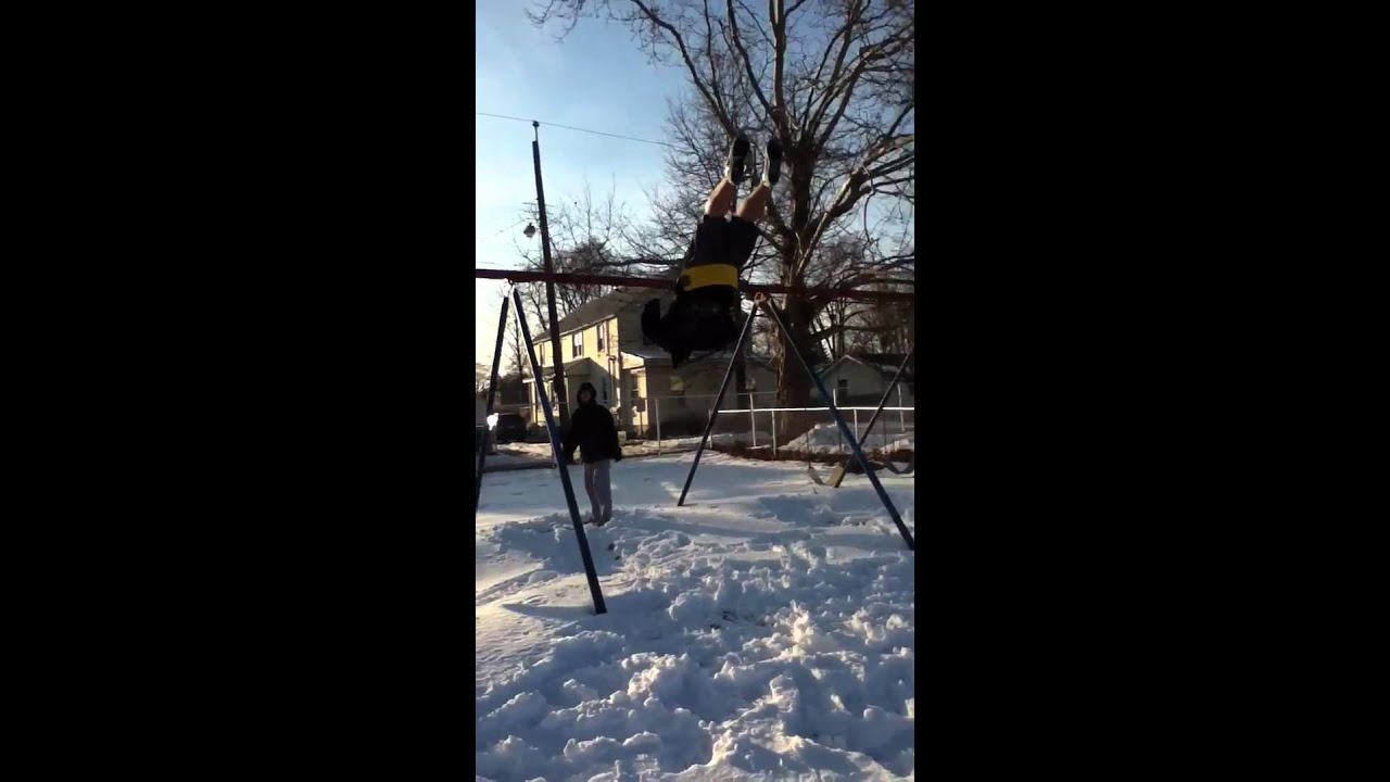 Paul jumping off swing set #4