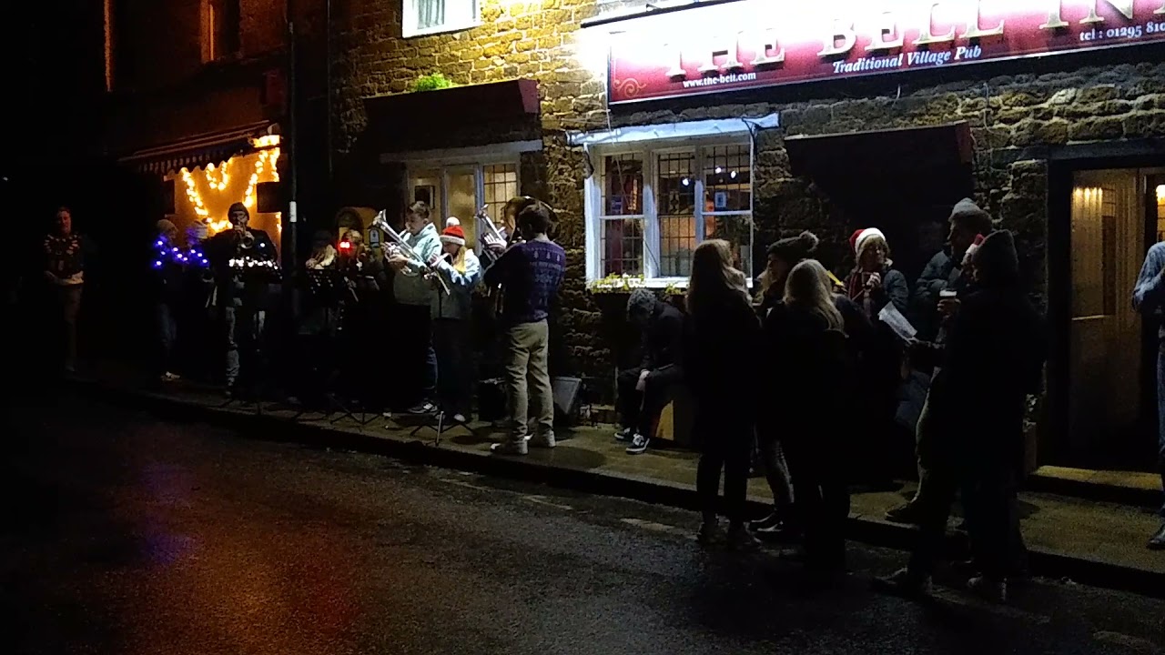 Adderbury Christmas carols outside the Bell December 2021.
