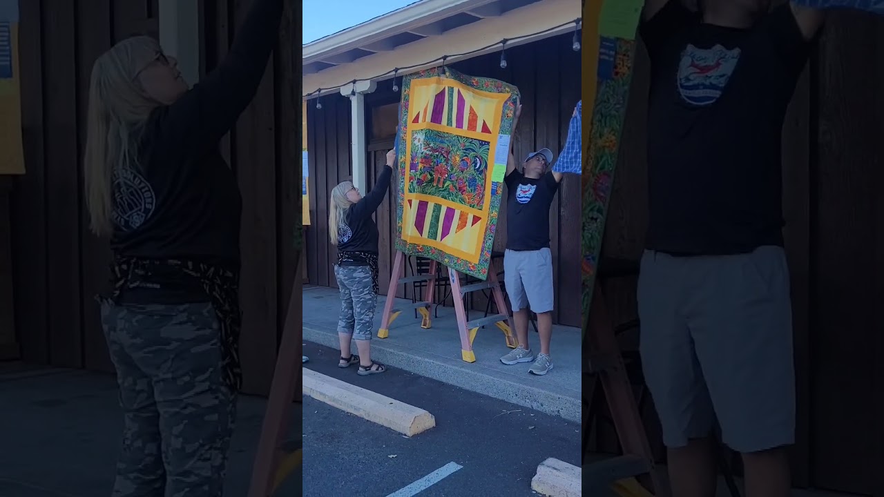 Hanging the Quilts at the Sisters Outdoor Quilt Show in Sisters, Oregon - July, 2025.  