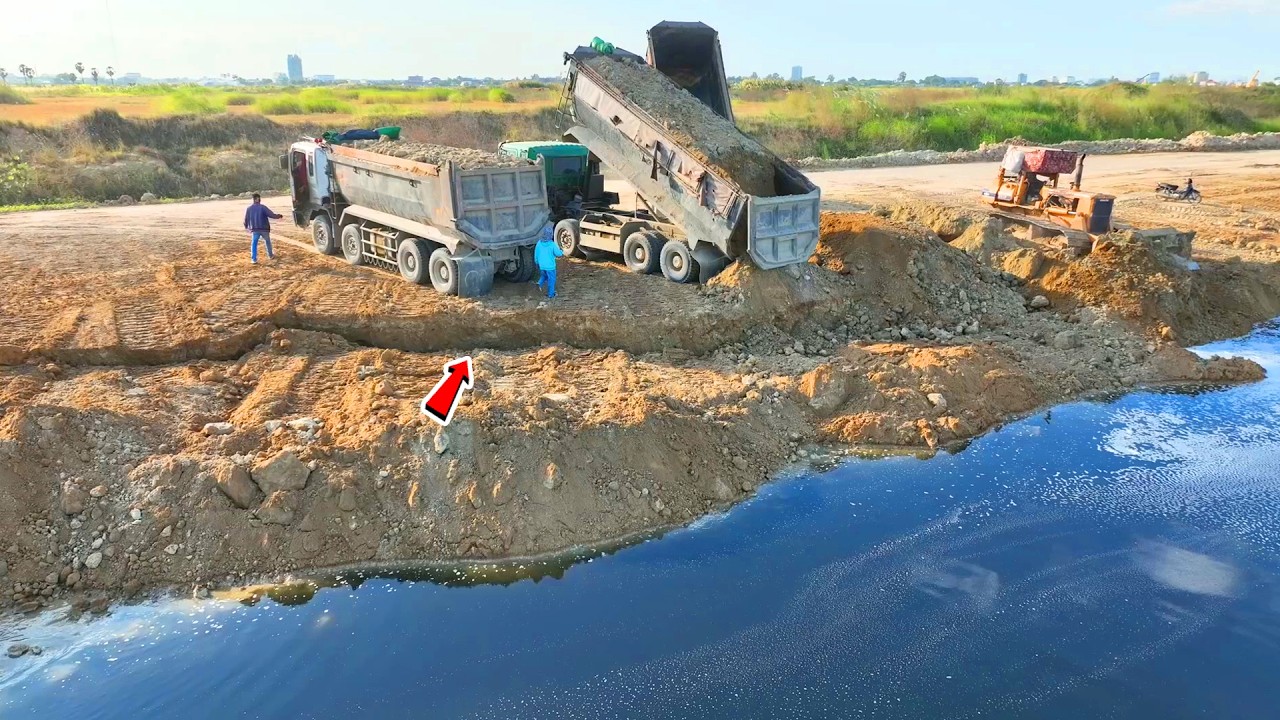 Best Action !! 25T Dump Trucks Waiting Soil With An Old Bulldozer Pushing Hard To Filling a Lake
