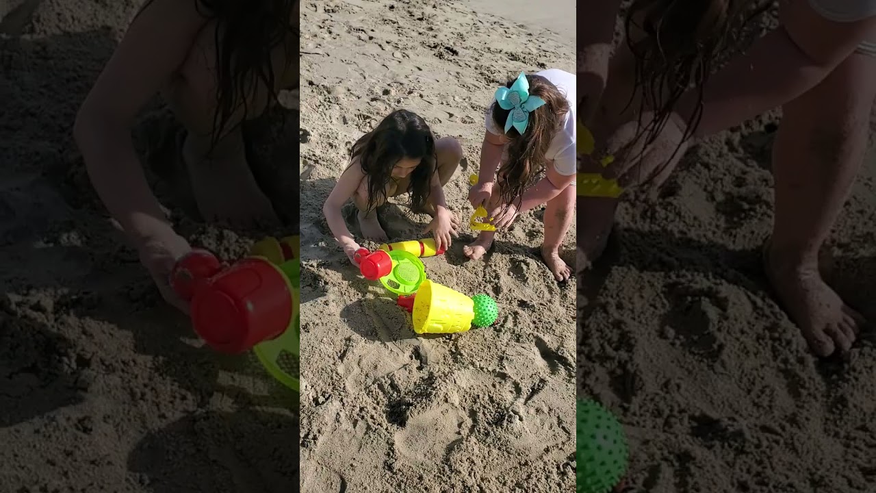 Kids are playing on the beach with sand and having lots of fun. 1st beach day of 2023