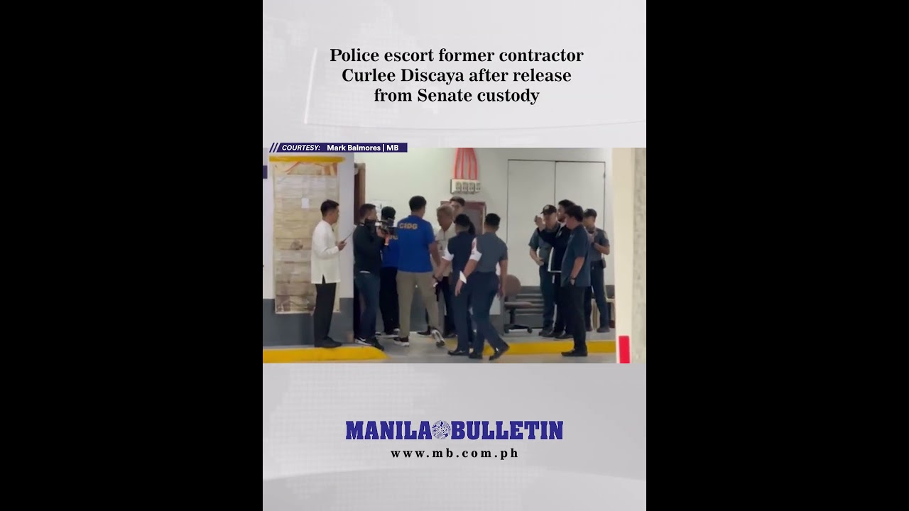 Police escort former contractor Curlee Discaya after release from Senate custody