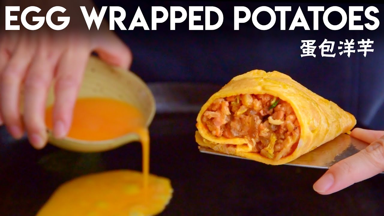Spicy smashed potatoes inside of an omelet.