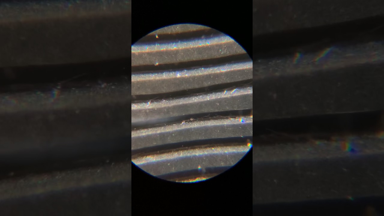 Vinyl record under a microscope. #Shorts