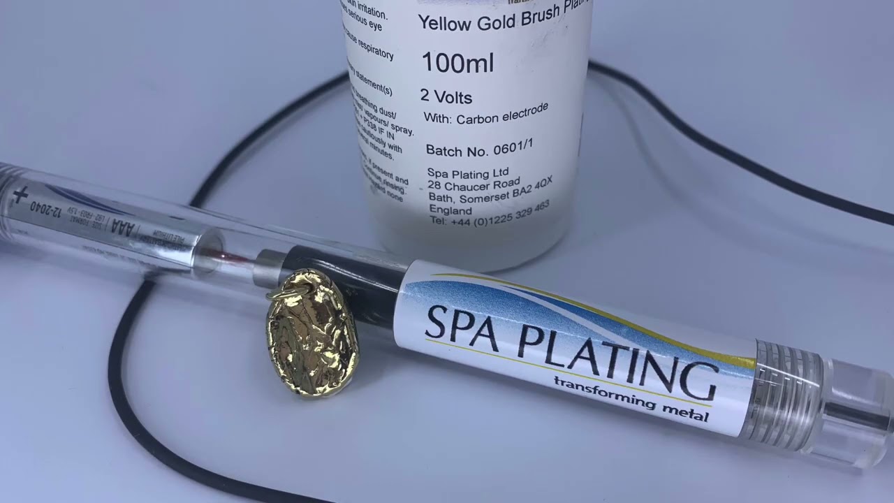 Gold brush plating silver clay.