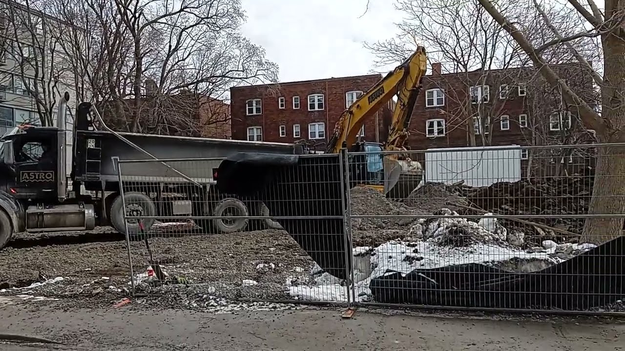 Toronto construction that never ends. Dump truck bulldozing wrecking crew 