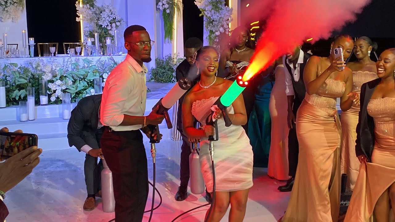 Lovely Couple! Baby Gloria & Jonas Mbaleka go Excitedly to blow Smoke Guns on their wedding day 