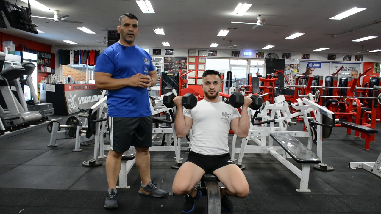 ضغط دمبلص جالس متكئ ملتوي من الامام  Dumbbell Twist Shoulder Press