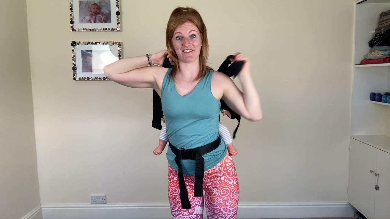 How to carry your baby on your back in a buckles baby carrier.