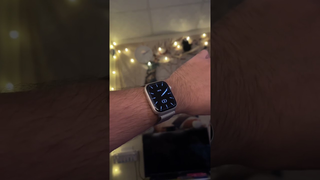 Apple Watch Series 8 45mm starlight with silver milanese strap and custom watch face.