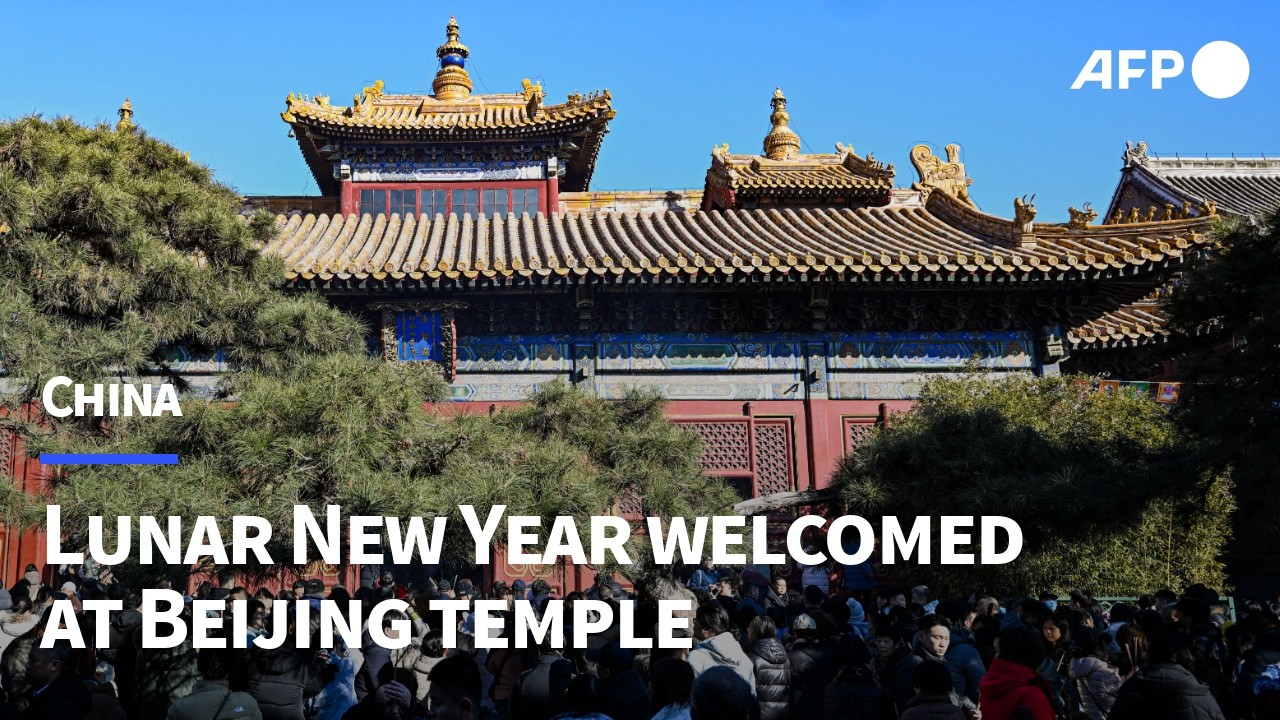 Chinese welcome Lunar New Year visiting Lama temple in Beijing | AFP