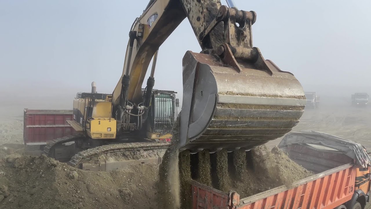 Caterpillar 385C Hydraulic Excavator Working On Hard Rock Layer Loading 4 Axle Trucks - Interkat SA
