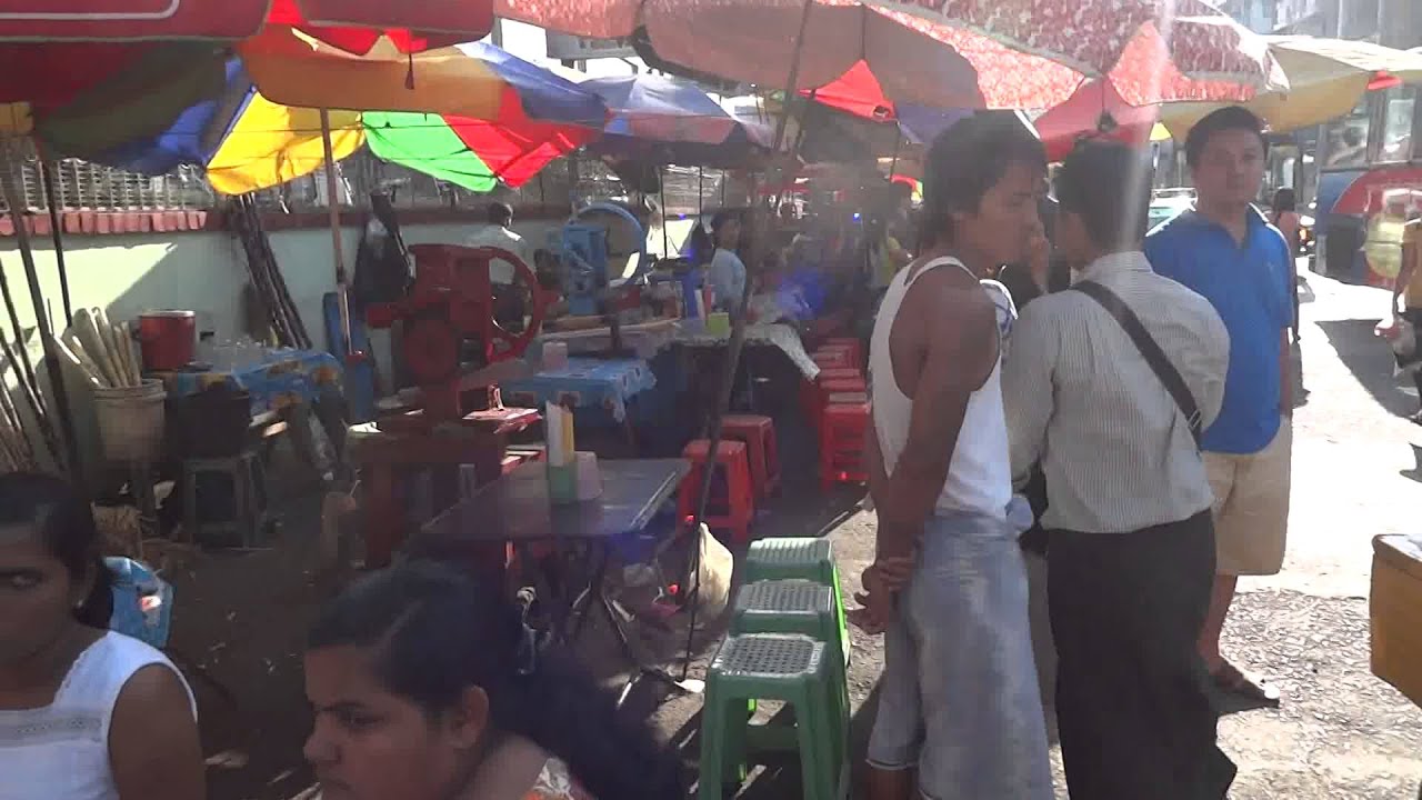 Busy streets of Yangon, Myanmar at entrance of a shopping center