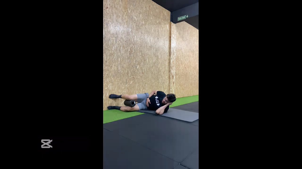 Left side lying breathing w/ foam roller & hip shifts 