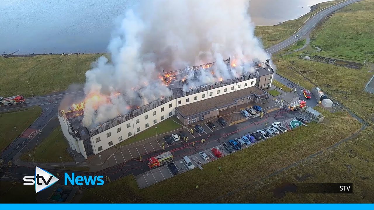 Firefighters tackle blaze as it tears through island hotel