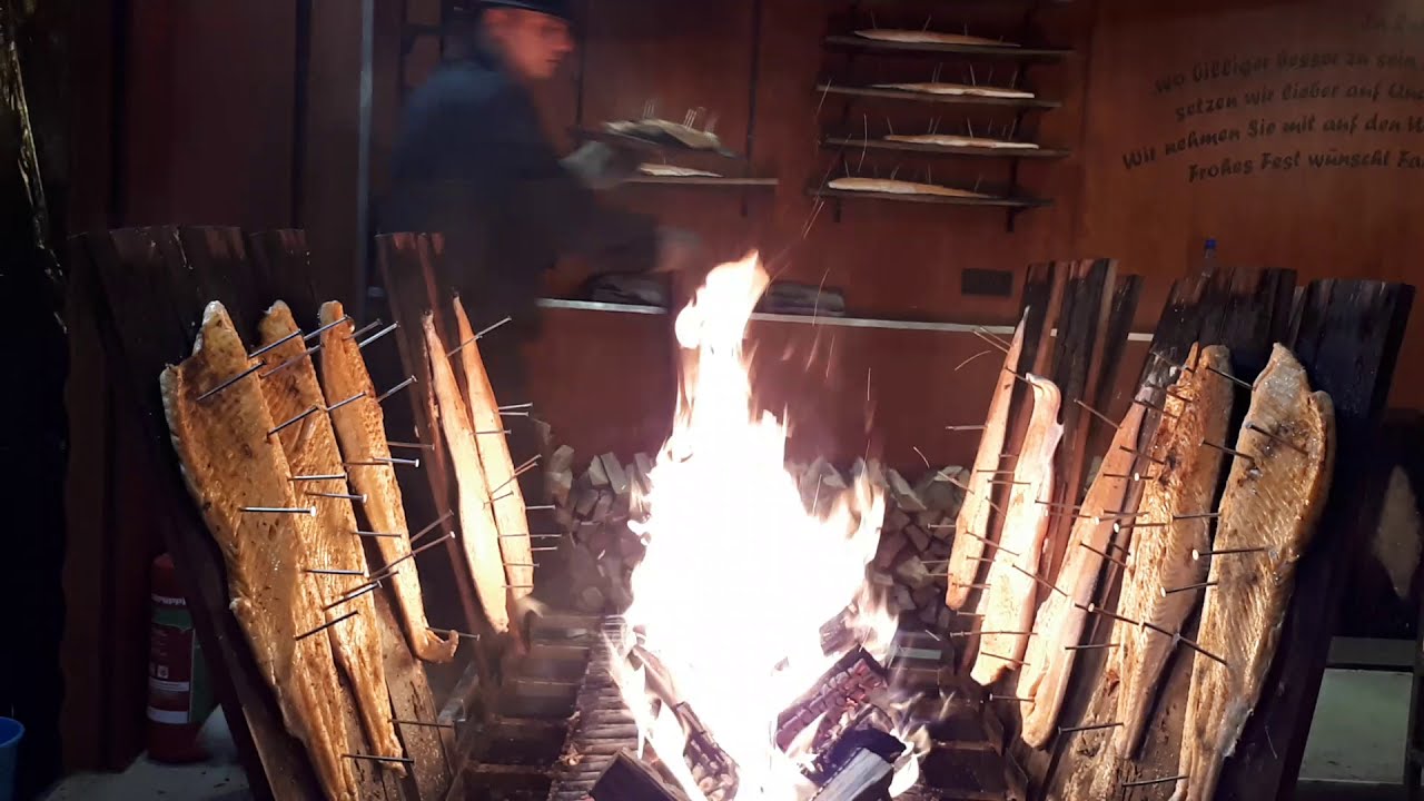 Traditional Flamed Salmon (Flammlachs) at Medieval Christmas Market in Bonn, Germany