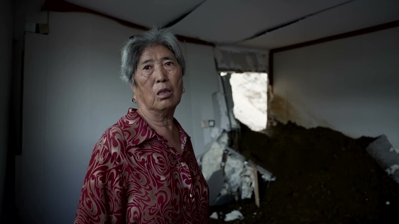 Beijing floods, landslide punch hole in home wall | REUTERS