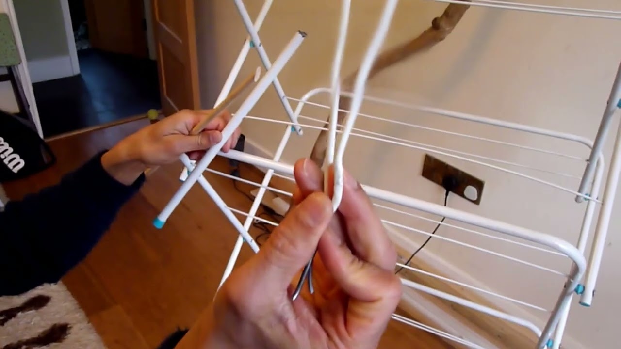 Fixing a broken clothes horse with a wooden hanger