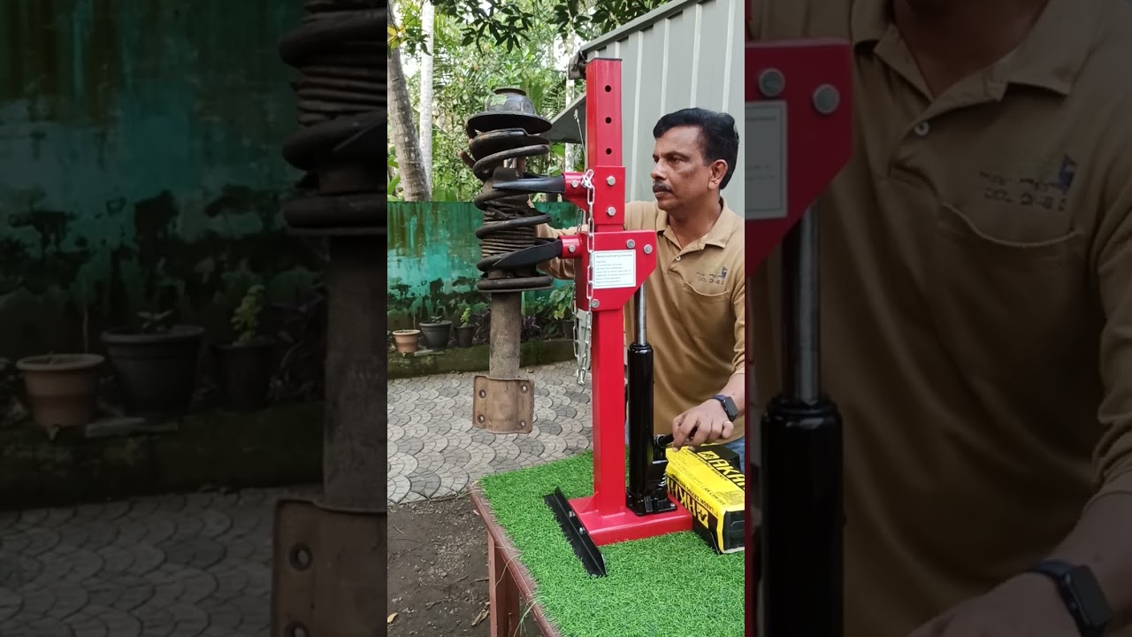Hydraulic coil spring compressor